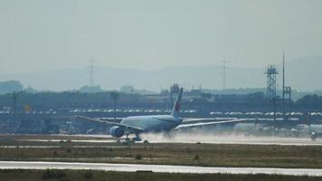 FRANKFURT AM MAIN, GERMANY JULY 20, 2017 - Air Canada Boeing 777 accelerate before departure at 25C, rainy weather, slow motion. Fraport, Frankfurt, Germany video