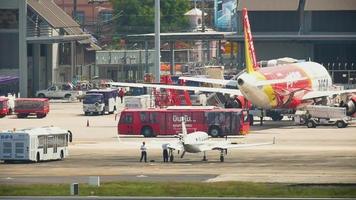 PHUKET, THAILAND NOVCEMBER 28, 2016 - AirAsia Airbus 320 HS ABL taxiing ends, Phuket International airport video