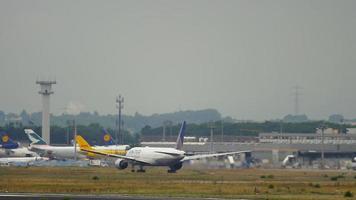 FRANKFURT AM MAIN, GERMANY SEPTEMBER 5, 2015 - United Airlines Boeing 777 take off and climb. The plane takes off from the airport, slow motion video