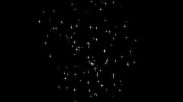 Beautiful shimmering particles on dark background, bright particles flying smoothly randomly video