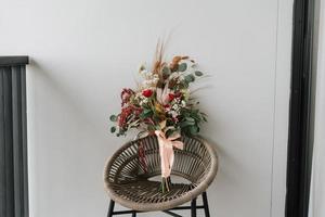 Rustic red rose flower hand bucket decoration for special occasion like wedding, engagement, anniversary and romantic dinner. photo