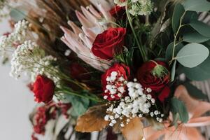 Rustic red rose flower hand bucket decoration for special occasion like wedding, engagement, anniversary and romantic dinner. photo