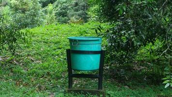 green trash can in tourist spot photo