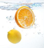 Lemon and orange in the water photo