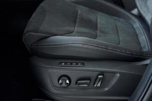 Comfortable seats. Close up focused view of brand new modern black automobile photo