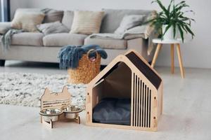 Little pet booth is on the floor in modern domestic room photo