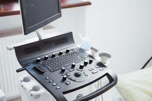 Close up view of control desk of ultrasound device in the clinic photo