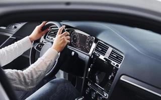 Particle view of man in formal wear that riding brand new car photo