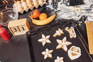 Close up view of eggs, milk, fruits and other indedients that on the table photo