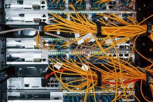 Close up view of internet equipment and cables in the server room photo