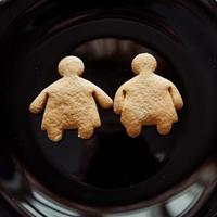 Pile of cookies on a black plate photo