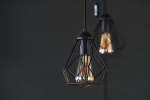 Modern designed light bulbs hangs on the wall indoors. Decoration and domestic life photo