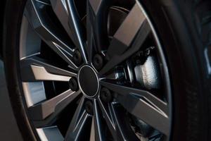 Detailed view of wheel of modern new car. Silver colored discs photo