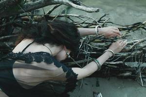 Close up lady lying on tree roots concept photo