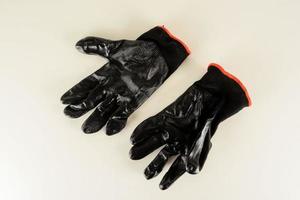 Black gloves on white background photo