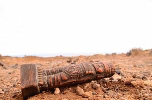 Pre Columbian figurine on the ground photo