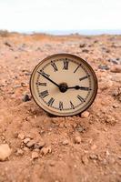 Clock on the ground photo