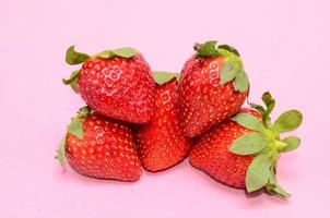 Strawberries on pink background photo