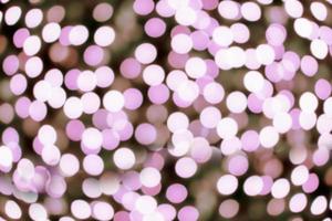 Blurred and bokeh pink led lighting in full screen background. photo