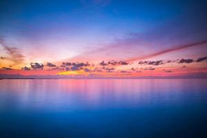 Inspirational calm sea with sunset sky. Meditation ocean and sky background. Colorful horizon over the water. Calmness, zen, tranquility concept, freedom and carefree design, nature scenery photo