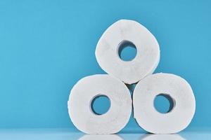 Toilet paper rolls on a blue background. photo