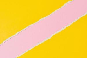 Torn ripped paper edge with a copy space, pink and yellow color background