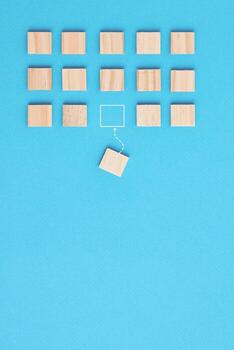 Group of wooden blocks and one another block in another direction photo