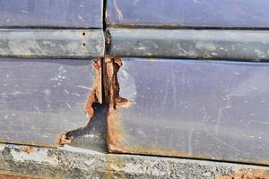 Rusty old car damaged by corrosion photo