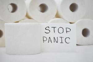 Toilet paper rolls with inscription stop panic photo