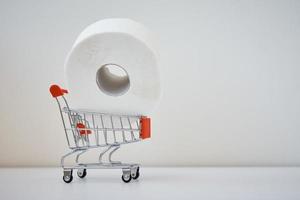 Toilet paper roll in a shopping trolley photo