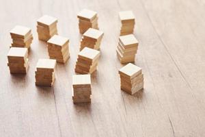 Stacked in the towers wood blocks on wooden table with copy space photo