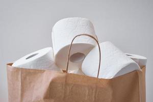 Toiket paper rolls in shopping bag photo