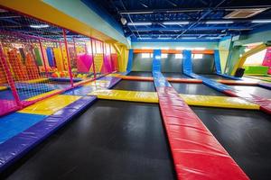 Set of trampolines at indoor play center playground. photo