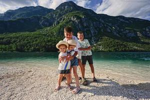 Four children in Lake Bohinj, the largest lake in Slovenia, part of Triglav National Park. photo