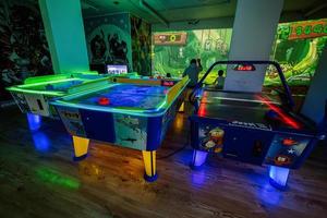 Air hockey tables at indoor kids playground. photo