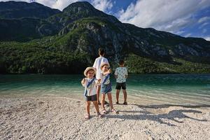 Four children in Lake Bohinj, the largest lake in Slovenia, part of Triglav National Park. photo