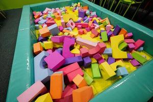 Pool with different geometric shapes at indoor play center playground. photo