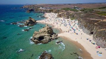 Aerial drone view of Beach in Algarve, Portugal during summer holidays. Amazing destinations.  Travel and adventure. Vacations on the seaside.  Exotic traveling. Most visited places. photo