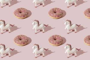 Simple and cute doughnut unicorn patern. Pastel pink color. photo