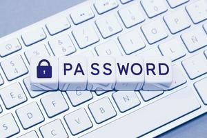 Password word and Closed padlock icon on cube blocks on computer keyboard photo
