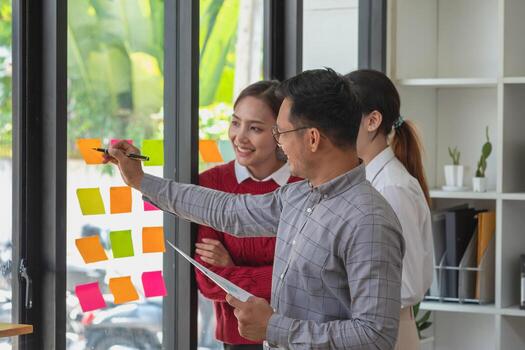 Accountant, businessman, The company is team of marketers analyzes the company is profits using laptop computer graphs and calculators. photo