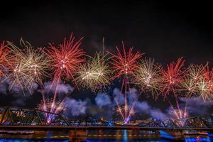 fireworks from Vijit Chao Phraya on Buddhayodfa Chulalok Maharat Bridge, Bangkok, Thailand. photo