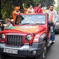 Delhi, India, December 02 2022 -Bharatiya Janata Party BJP supporter during mega road show in support of BJP candidate Pankaj Luthara to file nomination papers ahead of MCD local body Elections 2022 photo
