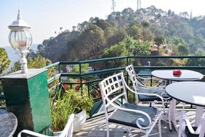 Early morning view of Modern rooftop restaurant at Kasauli, Himachal Pradesh in India, View of mountain hills from open air restaurant in Kasauli, Kasauli Rooftop restaurant photo