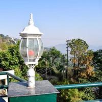 Early morning view of Modern rooftop restaurant at Kasauli, Himachal Pradesh in India, View of mountain hills from open air restaurant in Kasauli, Kasauli Rooftop restaurant photo