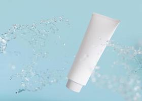 White and blank, unbranded cosmetic cream tube with water splash. Skin care product presentation on blue background. Modern mock up. Tube with copy space. 3D rendering. photo