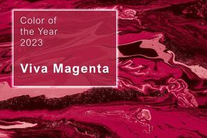 Viva Magenta - color of the year 2023. Trendy color sample. Beautiful toned surface with marble effect. photo