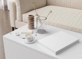 White book cover mock up with coffee cup, vase and other home accessories on white table. Blank template for your design. Book or catalogue cover presentation. 3D rendering. photo