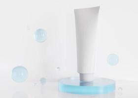 White and blank, unbranded cosmetic cream tube with blue spheres. Skin care product presentation on white background. Modern mock up. Tube with copy space. 3D rendering. photo