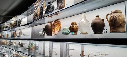 Chemnitz, Germany 11-12-2022. Archaeological museum of Saxony. Spectacular exhibition presents human and cultural history. Ancient ceramics, pottery, dishes. Antique exhibits. Historical heritage photo